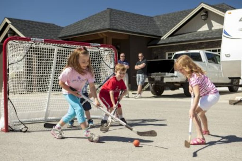 House located in a quiet cul-de-sac with access to hockey nets and a basketball hoop.