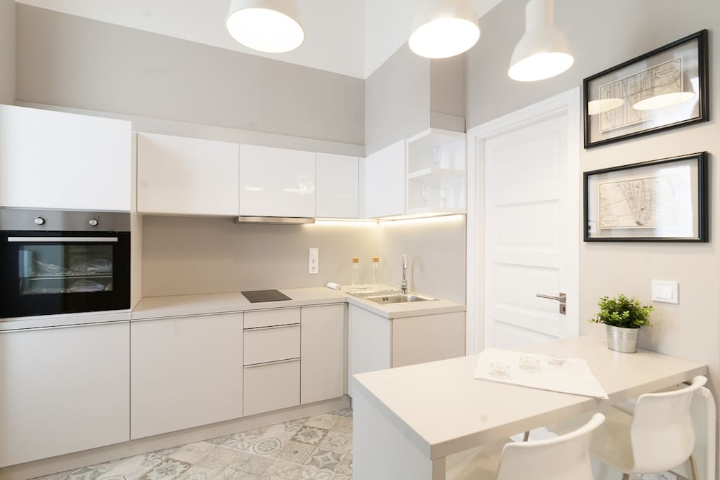the kitchen on the left, the dining table on the right