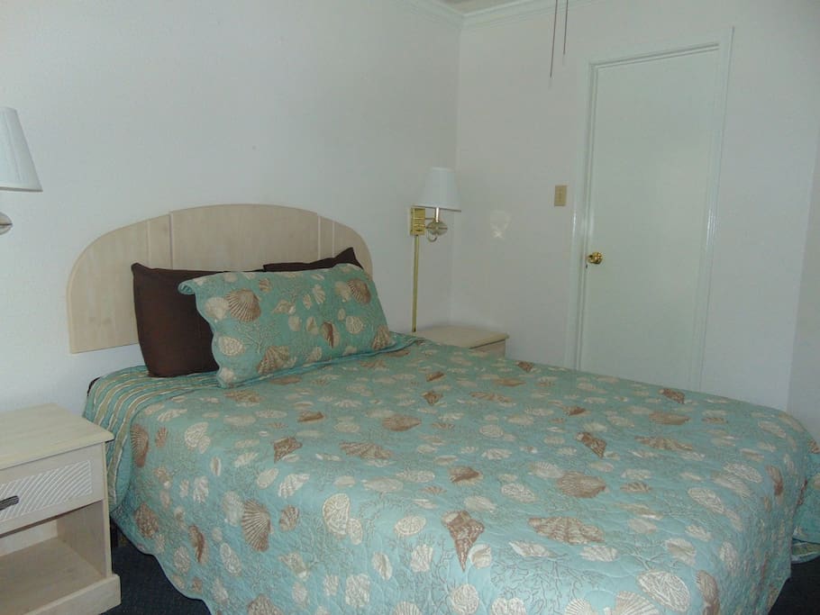 Comfy queen bed with closet for all your storage needs in bedroom