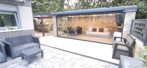 House with barbecue, bar, and gazebo