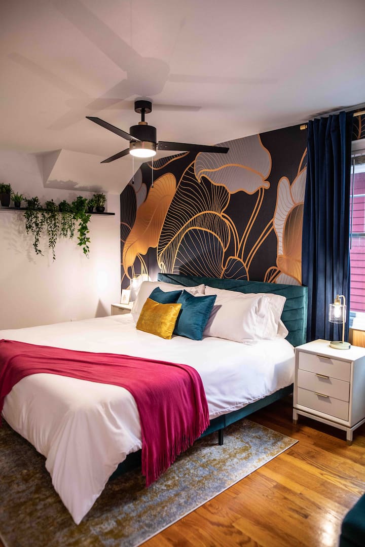 2nd floor bedroom with king bed with blackout curtains