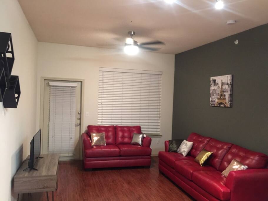 Spacious living room area and patio door - night time