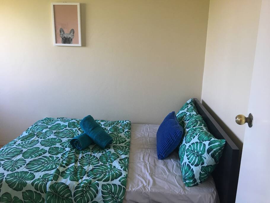 Double bed facing window