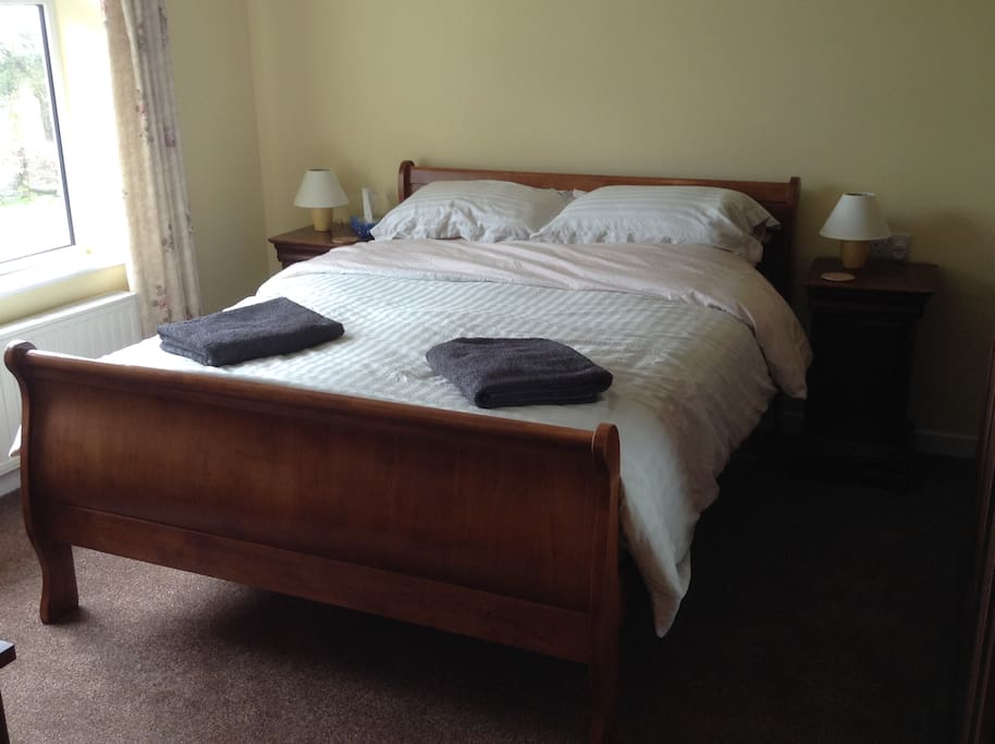 Here`s the king-sized bed in the sunny front bedroom.