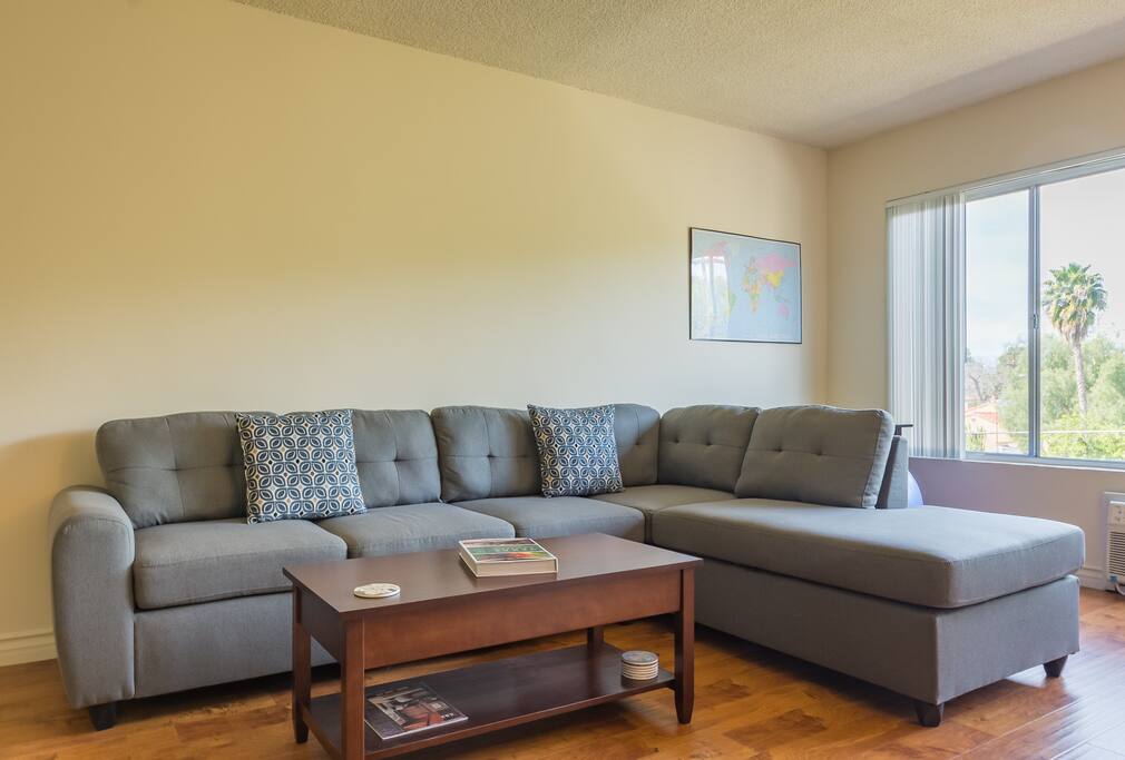 Large L-shaped sofa, can sleep 1 person comfortably