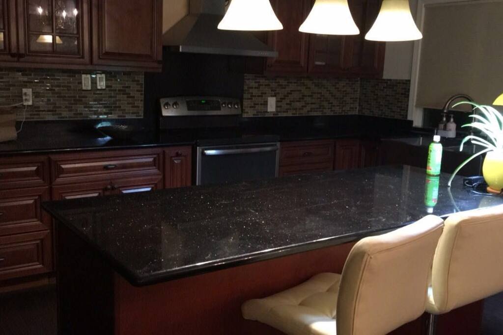 Full kitchen with island bar