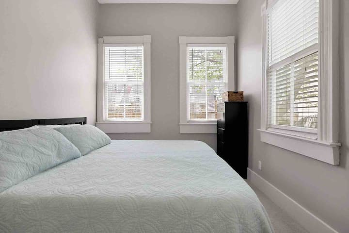 King-sized bedroom boasts plenty of natural light.