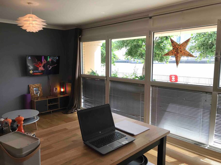 Kitchen island overlooking living area and the view of the Thames