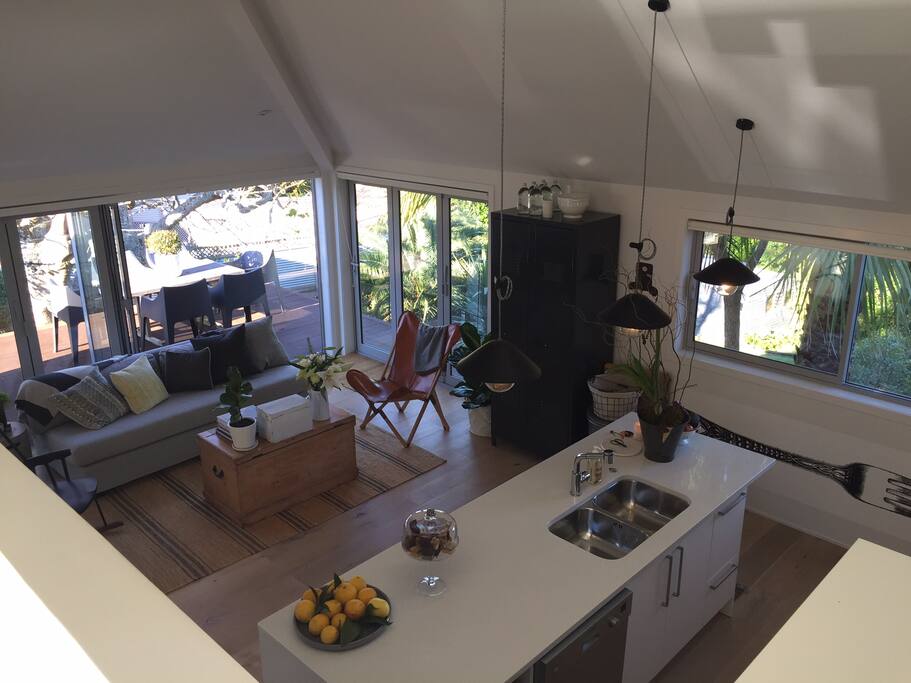 View of kitchen and second living area out on to deck - looking from Main bedroom landing