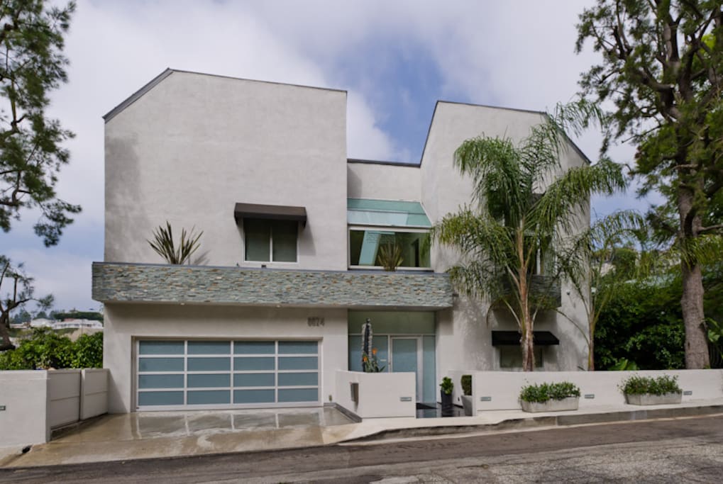 Street view....guest room is on the upper level by the black awning