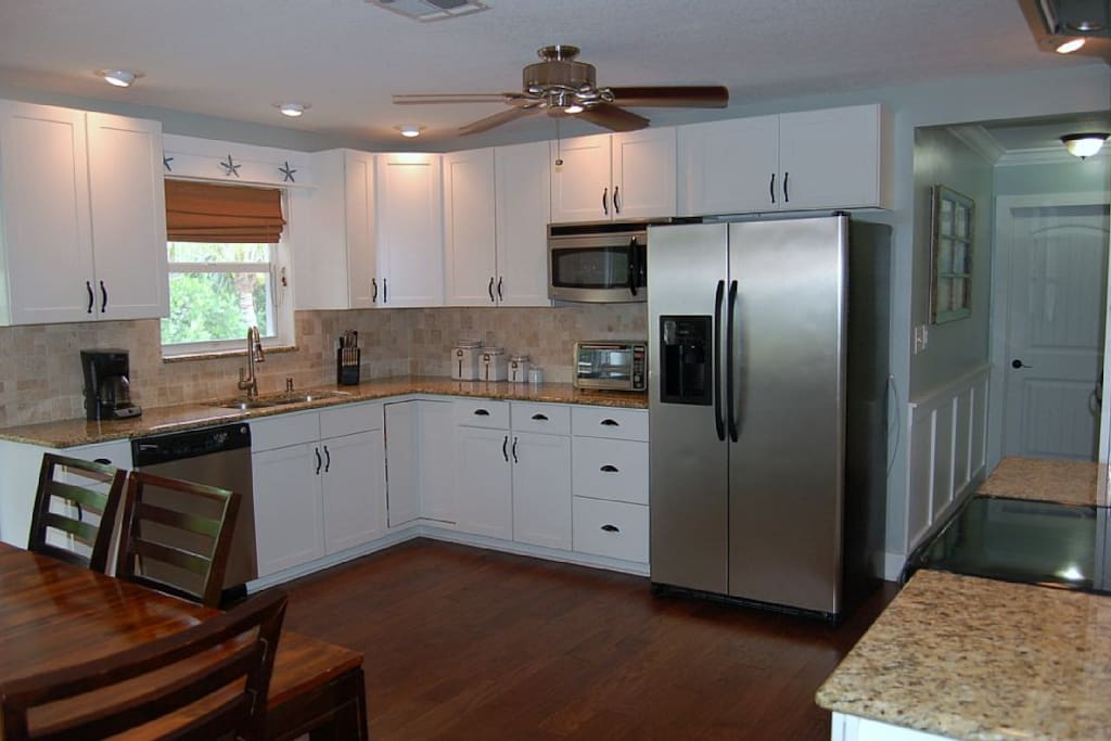 Kitchen with granite tops and stainless appliances