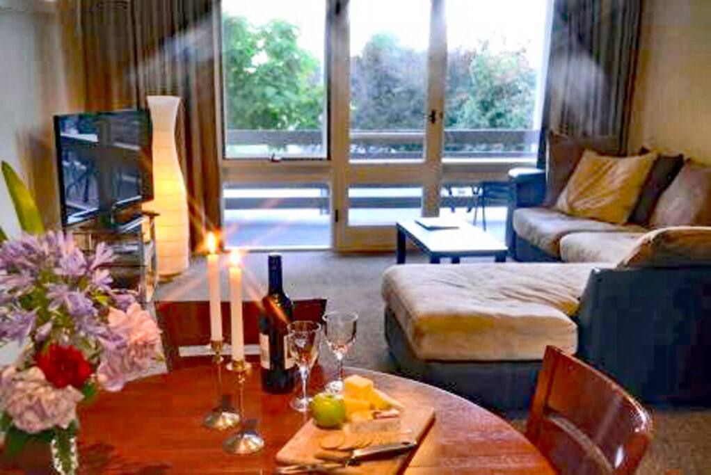 Stylized- Lounge room, open plan, leads onto the balcony.