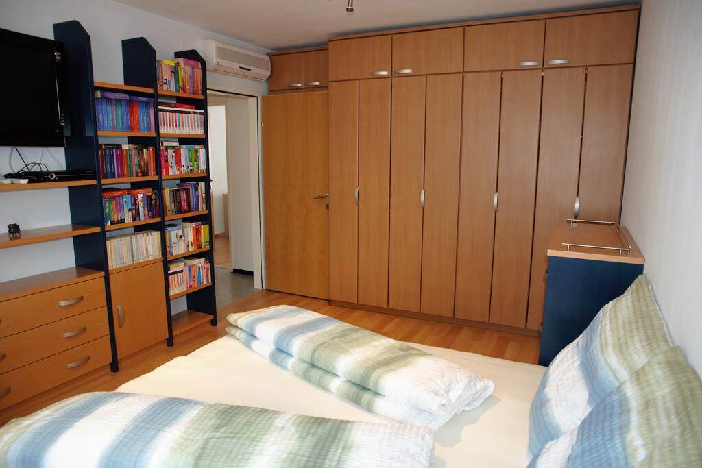 master bedroom with satellite tv