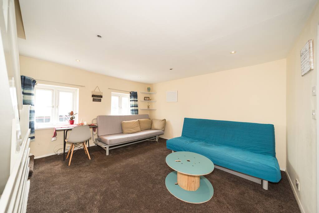 Please note there is a dining table in the living room now as well with 3 x chairs