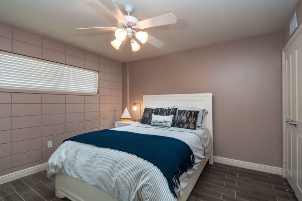 The second bedroom with a queen bed.