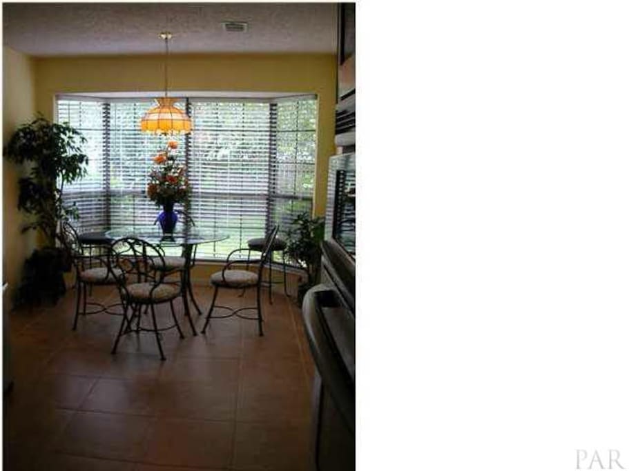 Sunny breakfast nook also offers desk workspace