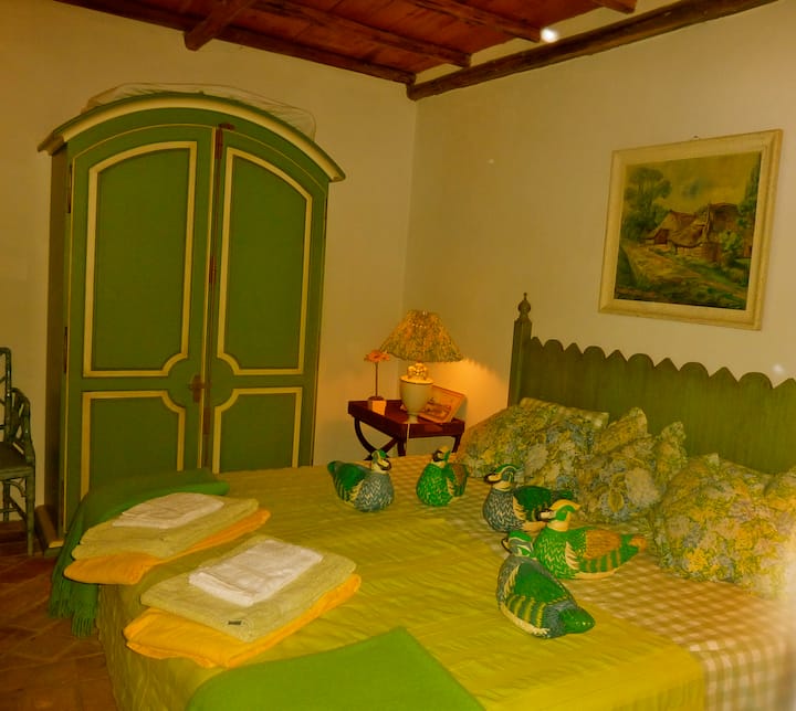 Green bedroom with bathroom