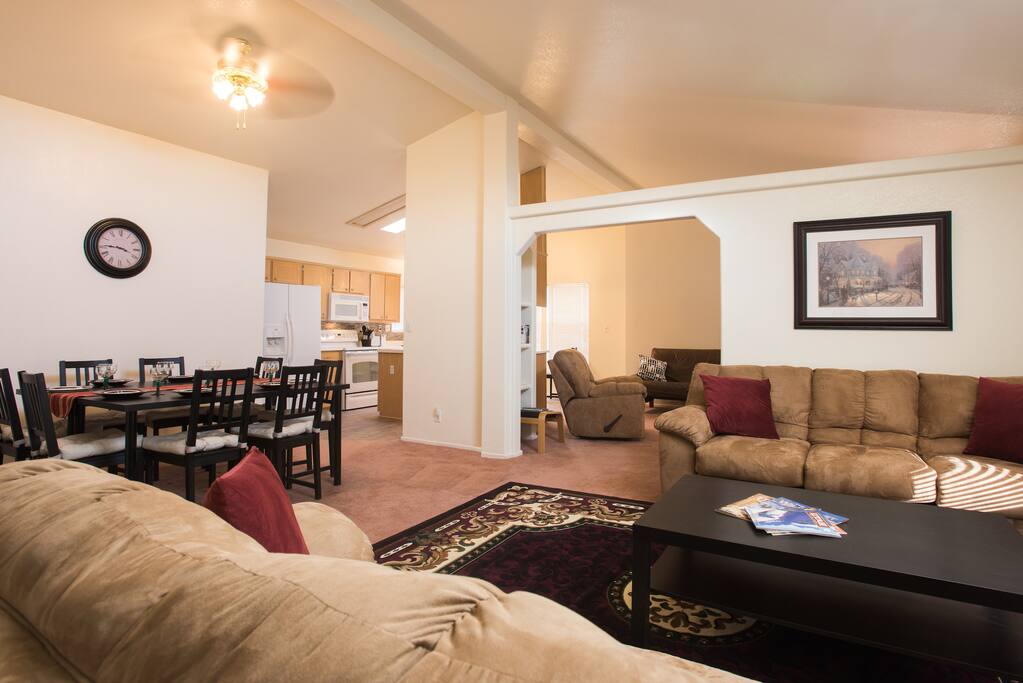 An open concept plan with 2 living areas, dining and kitchen.