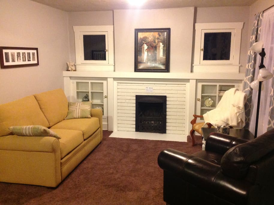 Living Room with Fireplace and sofa bed (memory foam mattess)