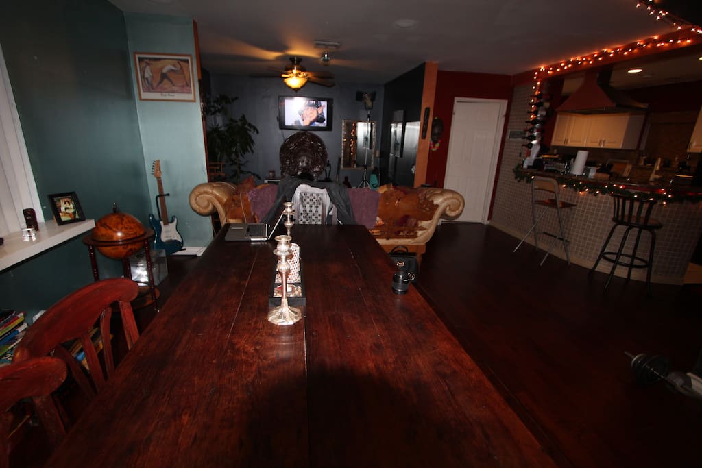 Large wooden dinner table for feast with friends.