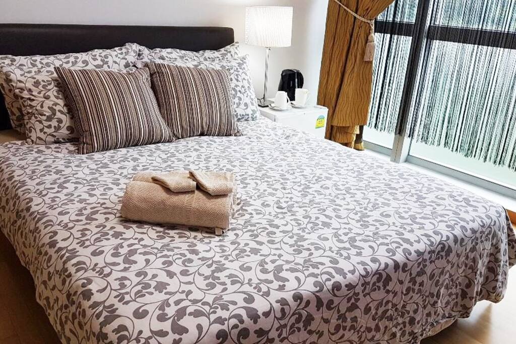 Queen Divan Bed with Beddings, Bar Fridge, Table Lamp, Electric Jug, Cup and Saucers etc.
