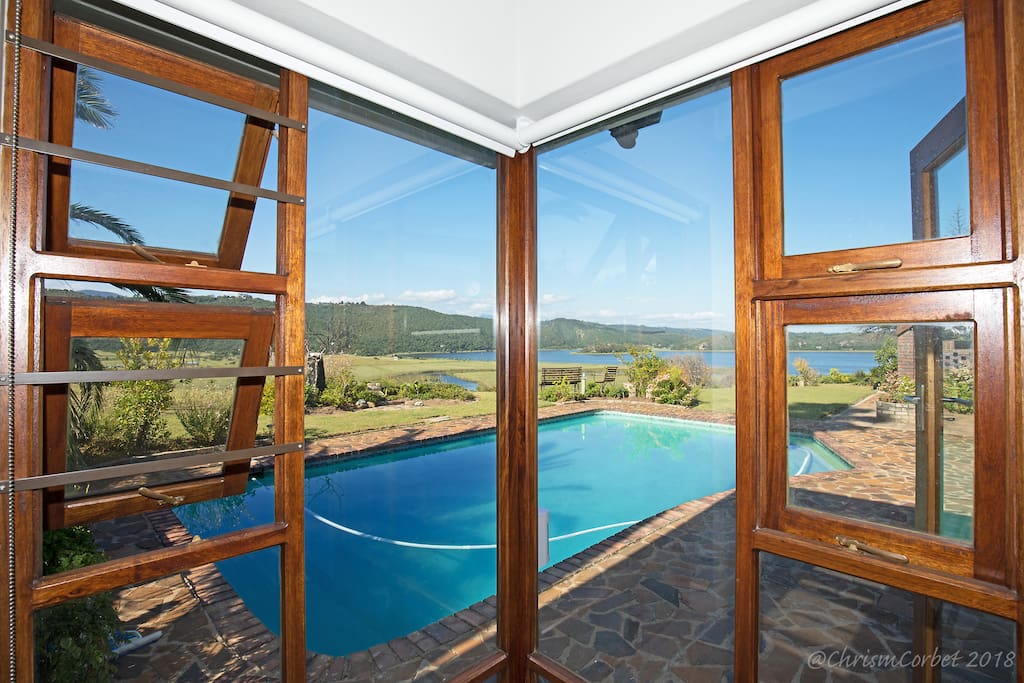 Main bedroom features amazing views of lake and river.