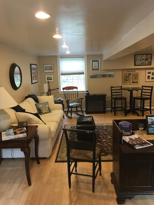 Partial view of living area with queen sleeper sofa. Motif is Middlebury College as I have 2 alumnae . Electric fireplace for ambiance.