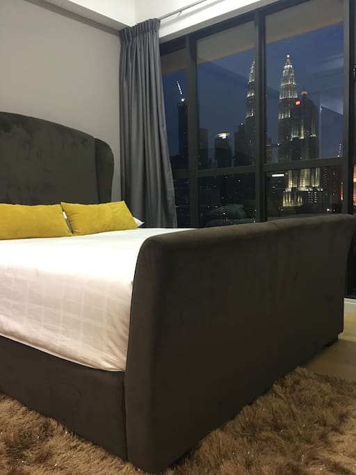 The comfy real bed in a comfortable bedroom with a magnificent view of KLCC