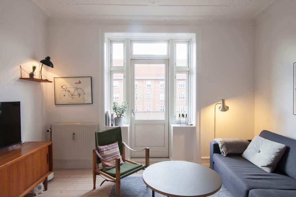 Livingroom with exit to front side balcony.