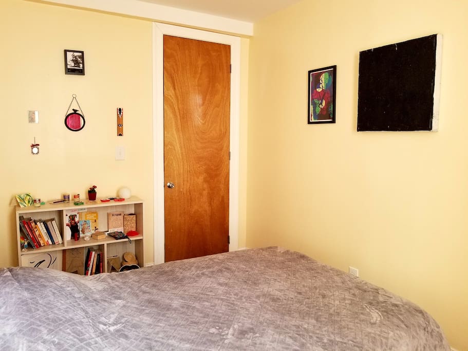 Bedroom with full/double bed, working area, nightstand and closet