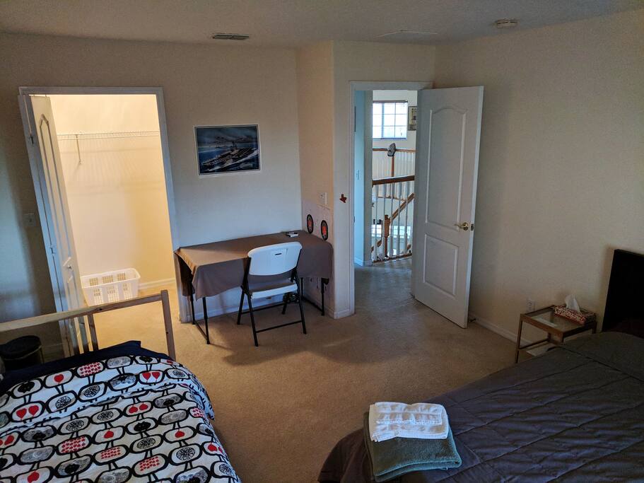 Deep closet and work desk in room
