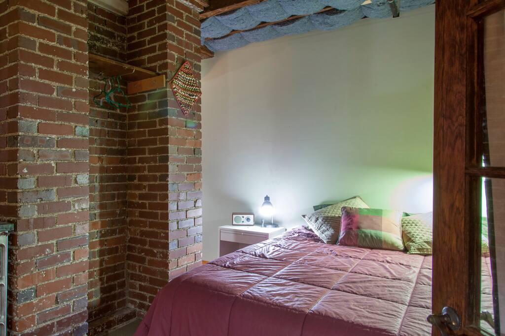 Comfy queen size bed with cotton sheets.