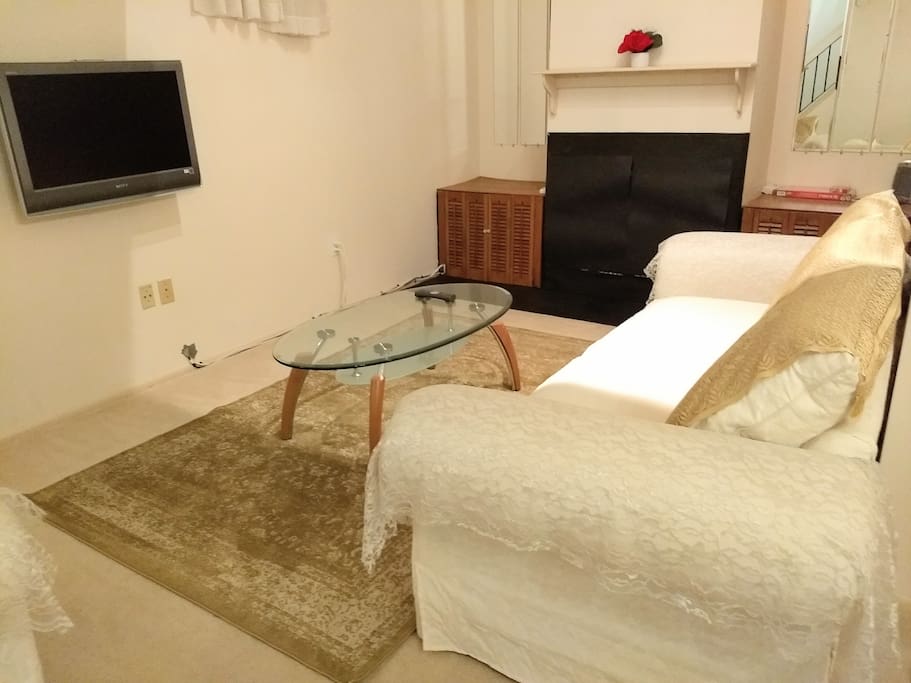 Living Room...golden carpet....white sofa..comfortable, clean...vibrant...positive energy