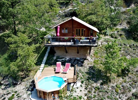 Chalet on stilts with hot tub in winter season