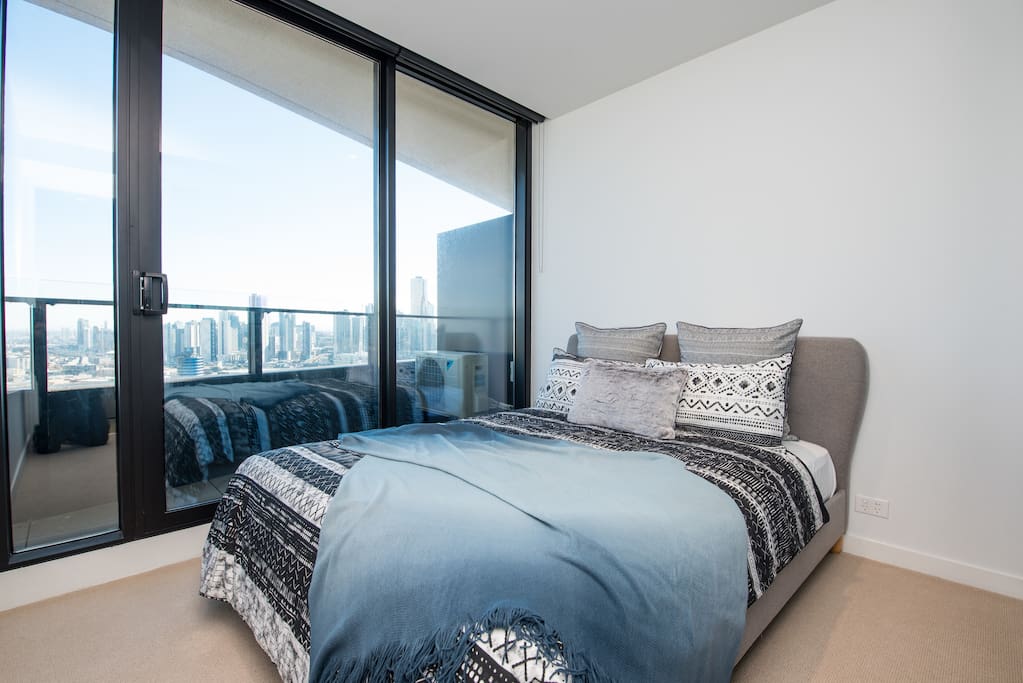 Master bedroom with view and mirror wardrobe