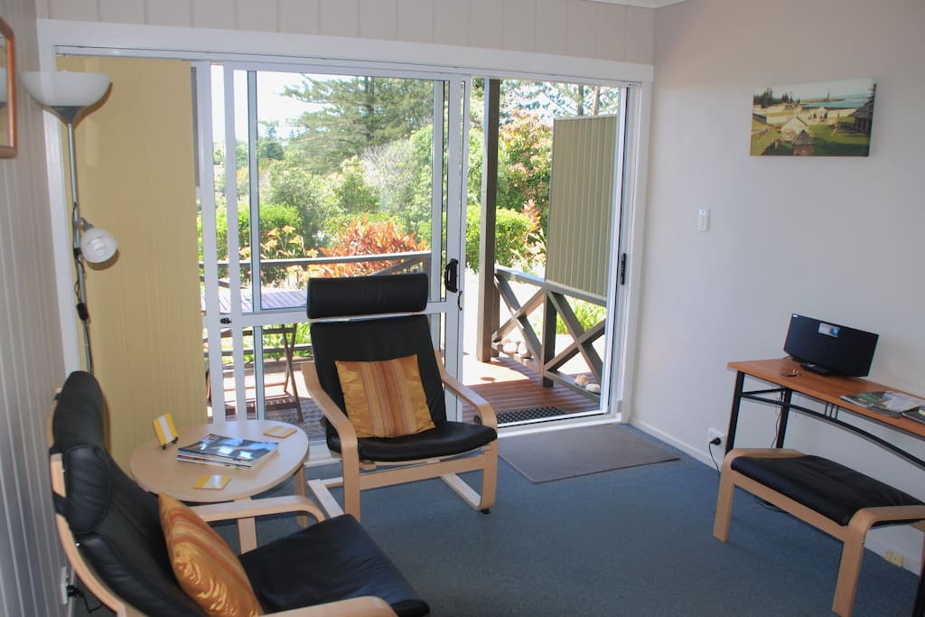 Comfortable leather lounge chairs in all apartments.
