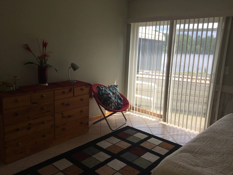 Lake view master bedroom with king size bed