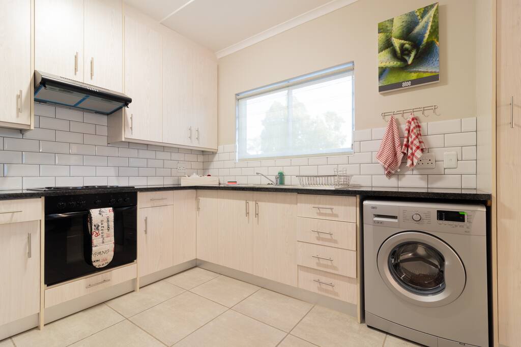 Fully equipped kitchen including washing machine