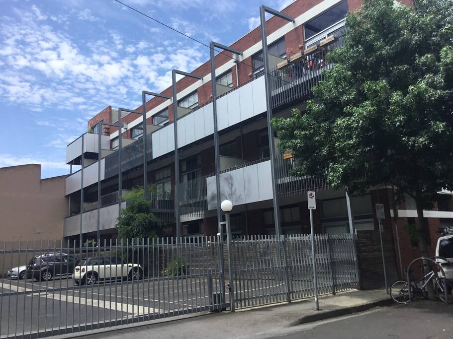 View of apartments and private balcony from Tennyson St. Private, secured parking space