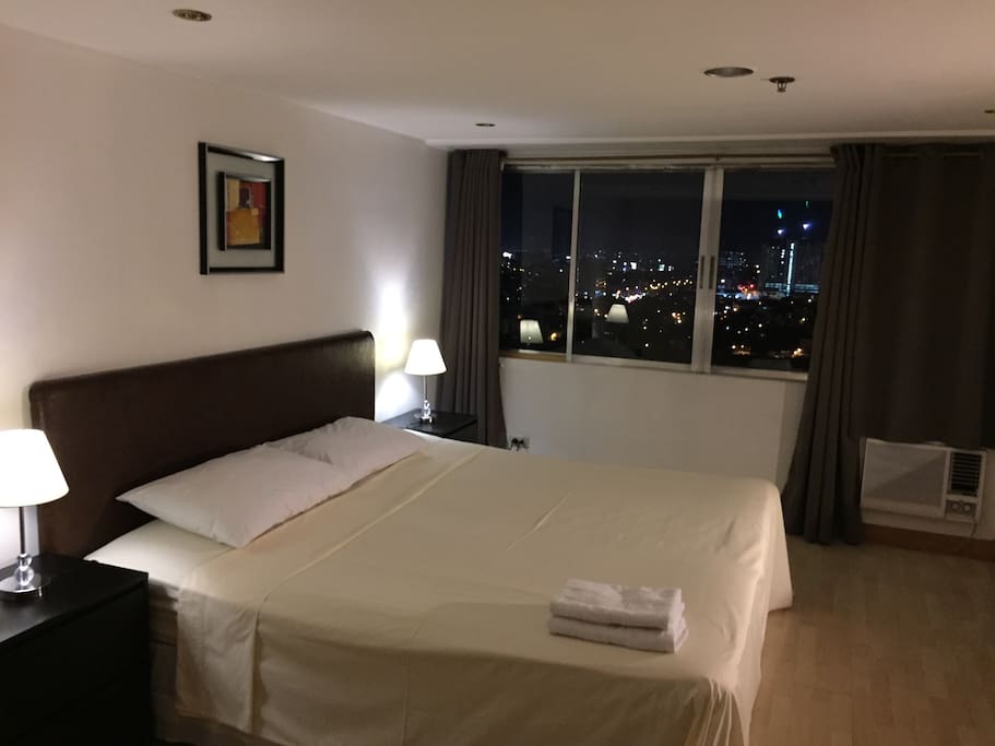 Large bedroom with a king sized bed and a fantastic view!