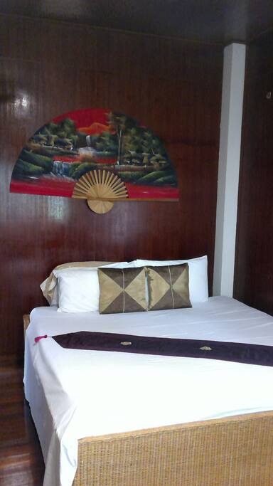 the guest room on the upper floor, traditional style - but with fan and aircon