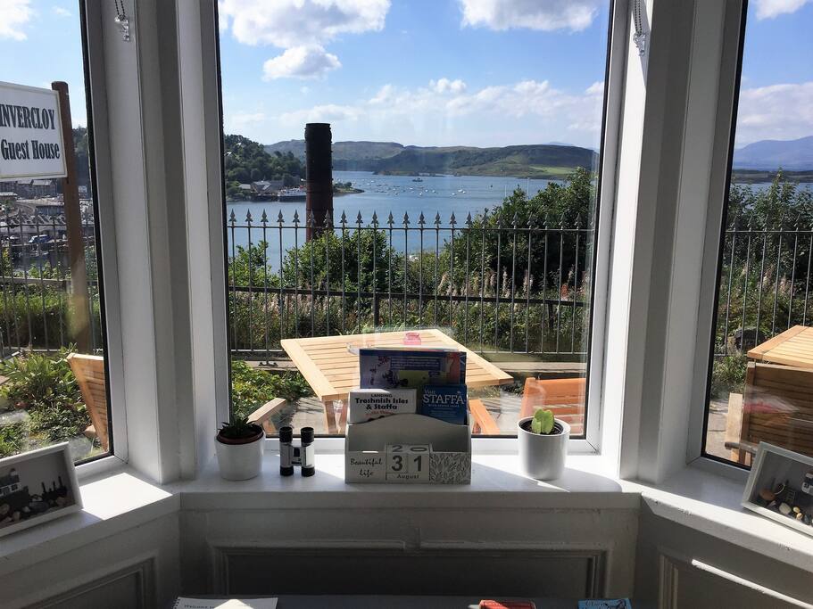 Sit outside on the terrace and enjoy the view , that's the Oban distillery chimney so we don't mind that ! :)
