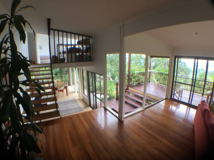 This shot shows some of the split levels in the house. The stairs up lead to a mini office space, bedrooms 1 and 2 and bathroom, downstairs is the dining area, to the right are the lounge room and deck
