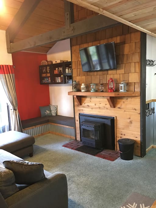 Main room with TV, VCR, DVD, playstation and Pellet Stove