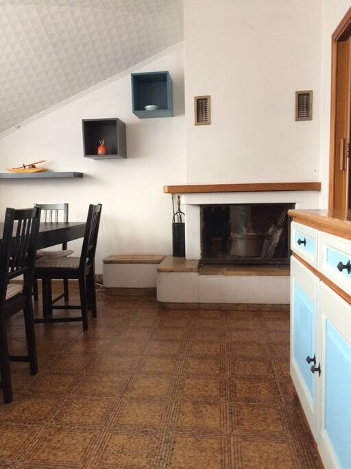 Kitchen table and fireplace.