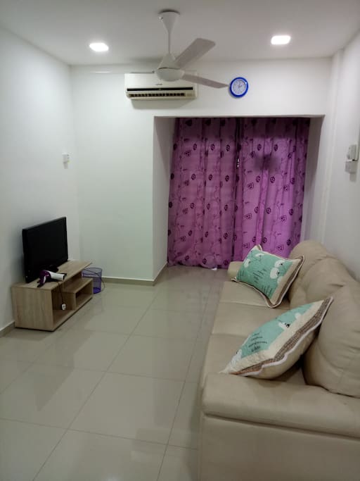 living room with 1 sofa bed, 1 single bed, tv, wifi, air-conitioning, ceiling fan, dining table...