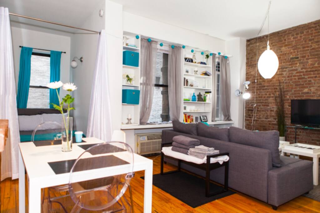 Amazing living room and sleeping area with updated furniture and cozy!
