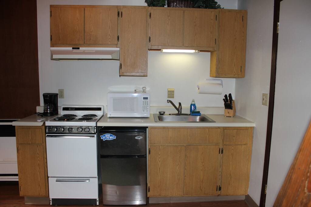 Mini kitchen opposite of futon