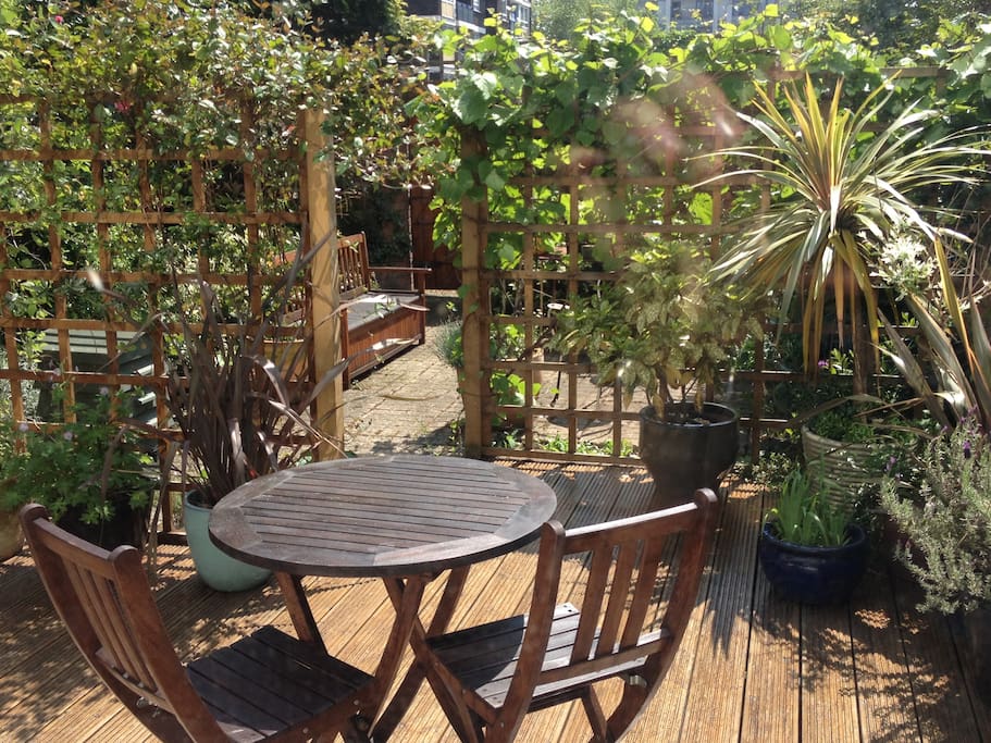 South facing garden with decking and garden furniture
