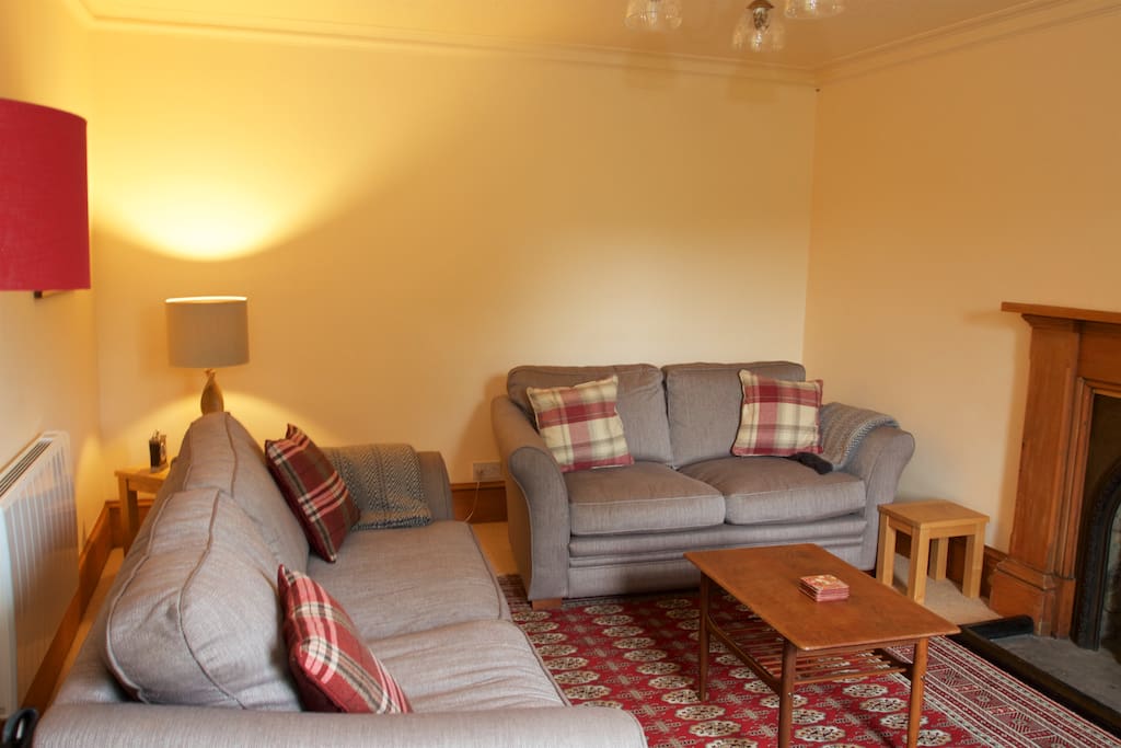 Living room with log burner, TV and wifi access.